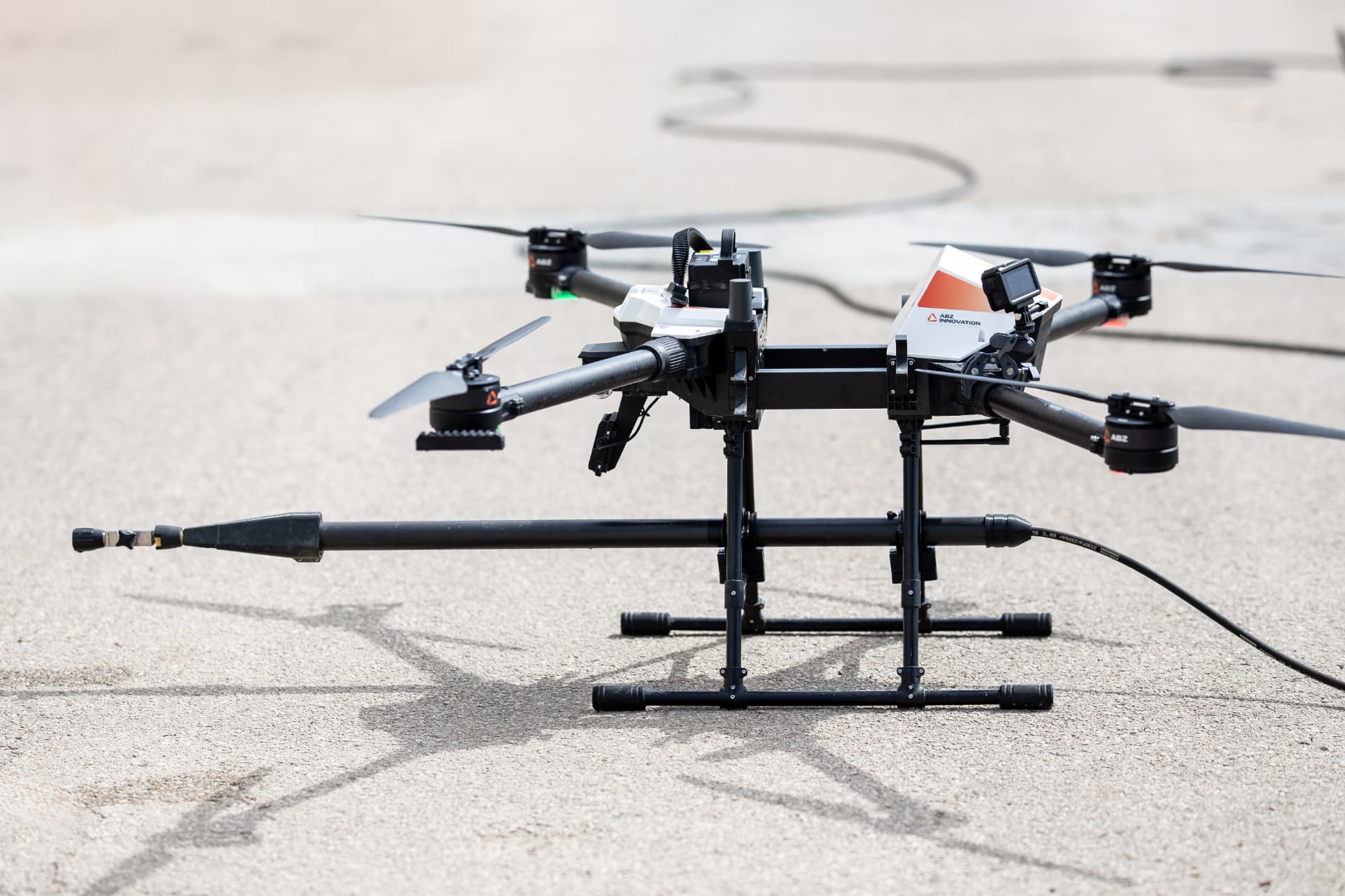 ABZ Innovation C10 aerial cleaning drone with pressure lance on the ground