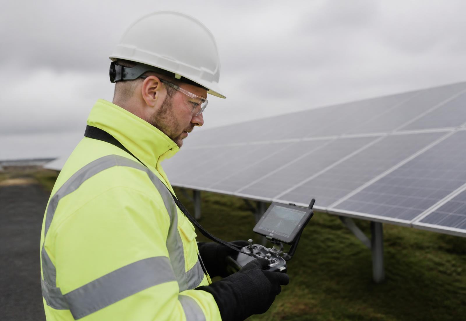 Drone operator inspecting a solar array in Ireland